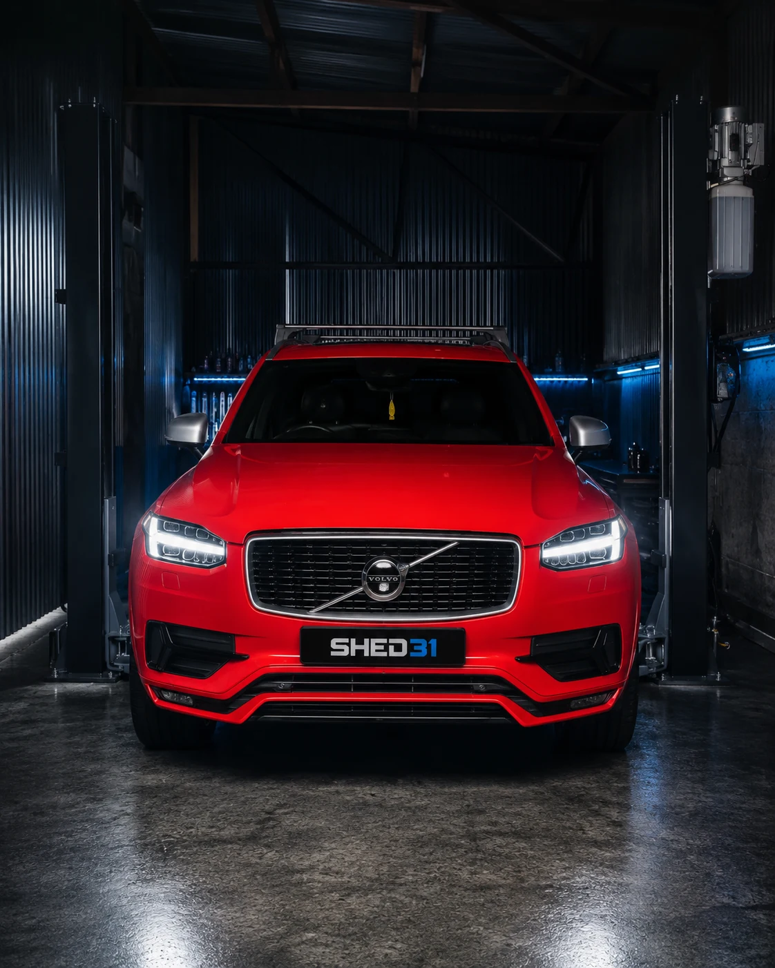 Red 2017 Volvo XC90 Hybrid 2.0 in the Shed 31 workshop